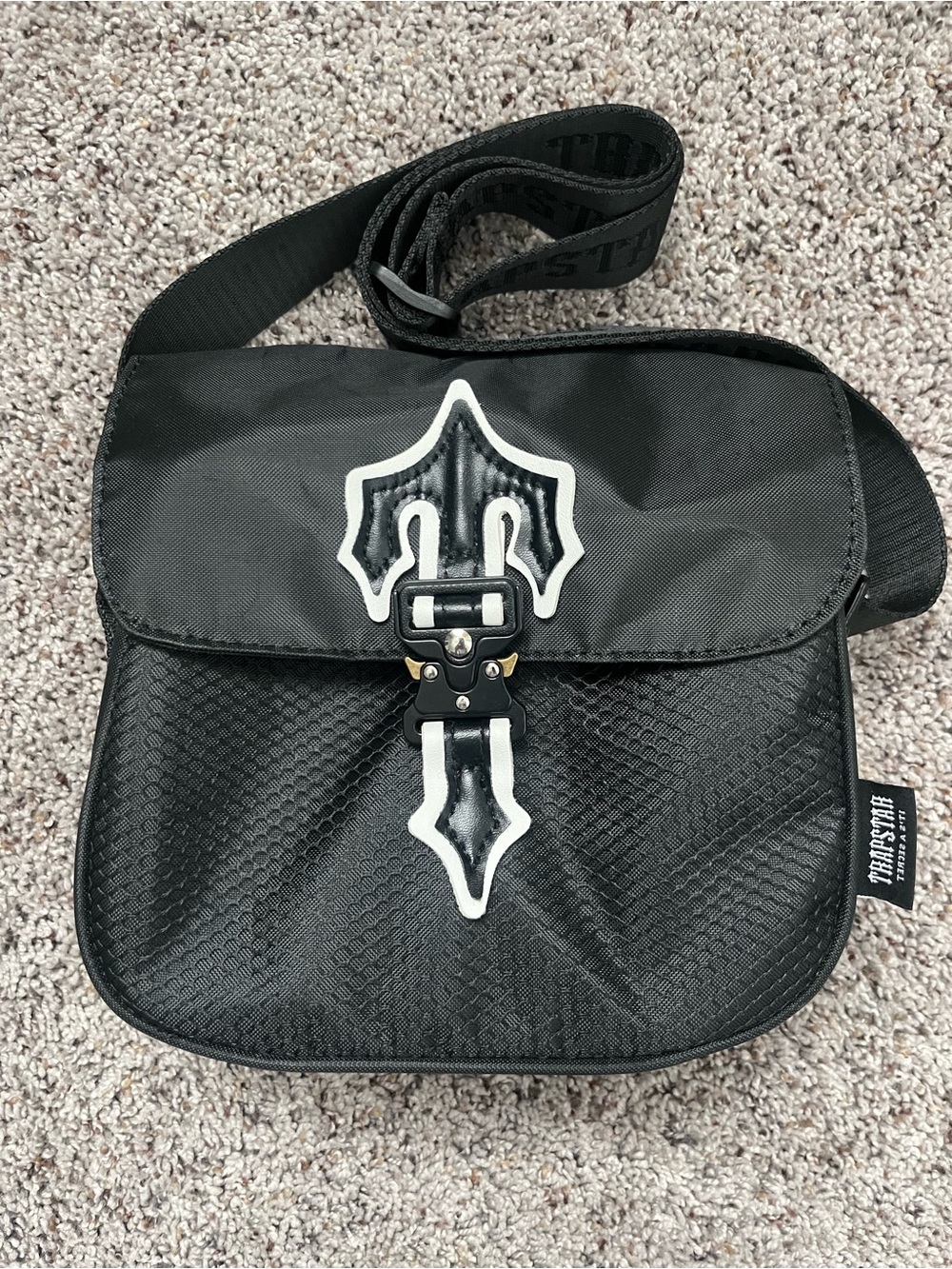 Black Messenger Bag with White Trim and Signature Buckle